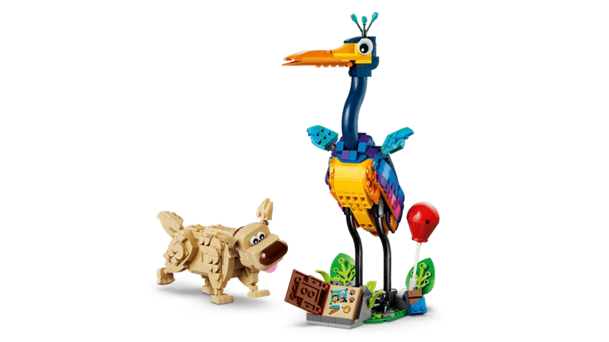 LEGO Disney Kevin standing on a decorated display base with green plants, a red balloon and My Adventure Book, alongside Dug without his protective cone.