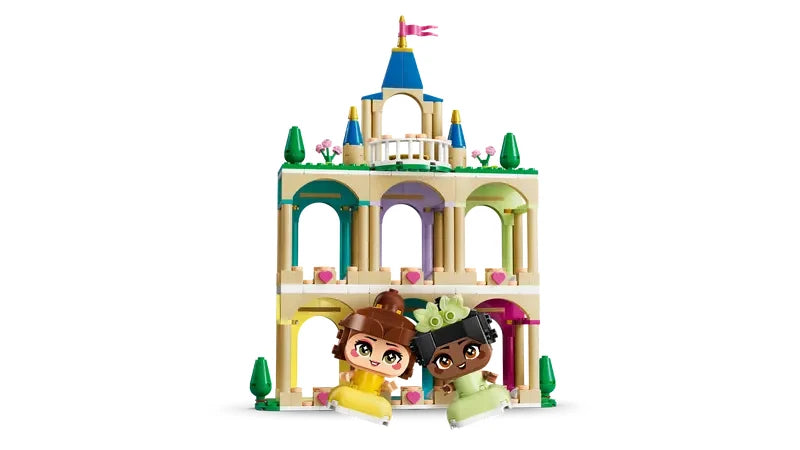 Front view of the LEGO Disney Princess castle with three levels, arches and Mini Belle and Mini Tiana figures placed at the base
