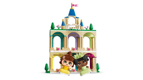 Front view of the LEGO Disney Princess castle with three levels, arches and Mini Belle and Mini Tiana figures placed at the base
