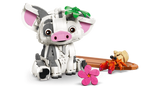 LEGO Disney Pua pig sitting beside a brown raft with an orange hermit crab, green leaf decoration on its head and a separate pink flower in the foreground.