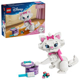 Retail box for LEGO Disney The Aristocats Adorable Marie shown beside the assembled white brick built cat with pink bow, gift box and small accessories on a white background
