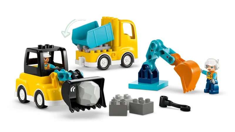 LEGO DUPLO yellow dump truck, loader vehicle with black scoop, teal excavator arm and two DUPLO figures.
