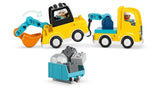 Two connected LEGO DUPLO yellow construction vehicles with teal excavator arm, wheeled cart, grey bricks and rounded stone piece