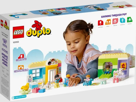 Child playing with LEGO DUPLO Town Life At The Day-Care Center 10992