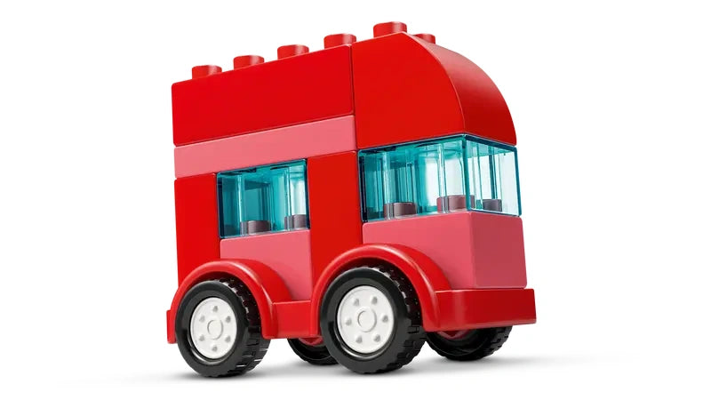 Single red LEGO DUPLO vehicle bus build with white wheels and black tyres on a white background