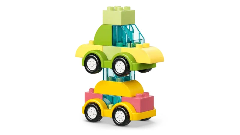 Two LEGO DUPLO car builds stacked vertically with yellow, pink and green bricks and black wheels on a white background