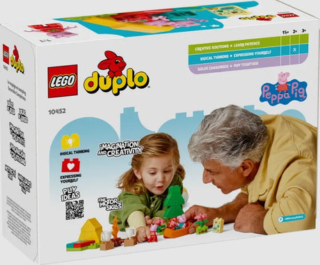 Child and adult playing with LEGO DUPLO Peppa Pig Camping Trip set 10452