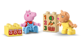 Peppa Pig and Pedro Pony DUPLO figures standing beside yellow jam jar brick and white number brick printed with 1 2 3 and matching food images