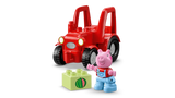 Red LEGO DUPLO tractor with black wheels carrying Peppa Pig figure and light green brick printed with a watermelon slice