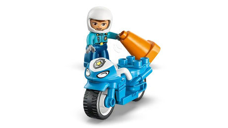 LEGO DUPLO police officer figure holding a traffic cone beside a blue police motorcycle