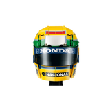Front close-up of LEGO Ayrton Senna Helmet 43024 showing yellow, green and blue racing colours and sponsor logos