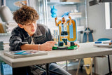 LEGO Editions Lionel Messi Football Legend 43015 building scene showing the model being assembled at a table.