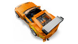 Top rear view of LEGO orange Toyota Supra car with grey rear wing