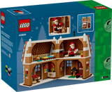 Rear of the LEGO Festive Gingerbread House 40809 box showing the open house interior and feature images