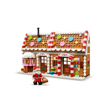 LEGO Festive Gingerbread House 40809 front view with Santa minifigure beside the decorated house