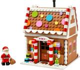 LEGO Festive Gingerbread House 40809 with Santa minifigure and brown sack beside the front entrance