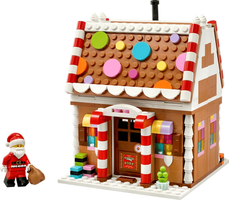 LEGO Festive Gingerbread House 40809 with Santa minifigure and brown sack beside the front entrance