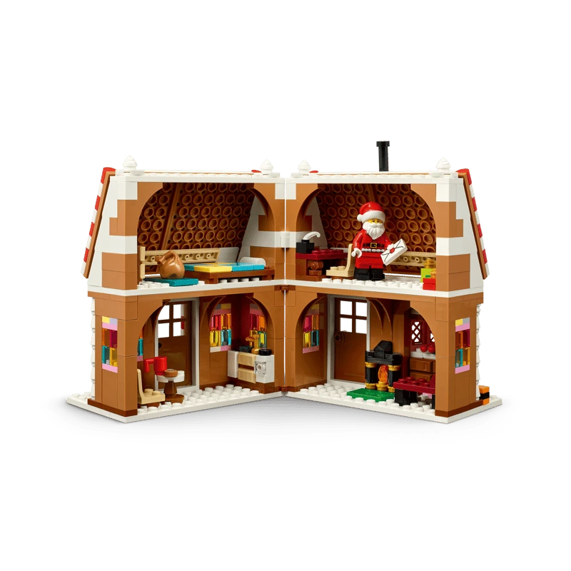 Open rear view of LEGO Festive Gingerbread House 40809 showing the furnished interior and Santa minifigure