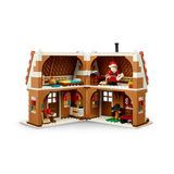 Open rear view of LEGO Festive Gingerbread House 40809 showing the furnished interior and Santa minifigure