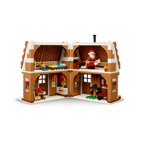 Open rear view of LEGO Festive Gingerbread House 40809 showing the furnished interior and Santa minifigure