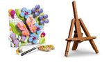 LEGO floral painting with brush and palette beside the back of the easel