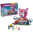 LEGO Fortnite Rave Cave 77082 retail box beside the completed pink Cuddle Team Leader bear model with purple roller coaster, colourful loops and minifigures.
