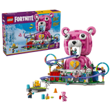 LEGO Fortnite Rave Cave 77082 retail box beside the completed pink Cuddle Team Leader bear model with purple roller coaster, colourful loops and minifigures.