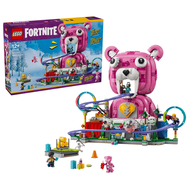 LEGO Fortnite Rave Cave 77082 retail box beside the completed pink Cuddle Team Leader bear model with purple roller coaster, colourful loops and minifigures.