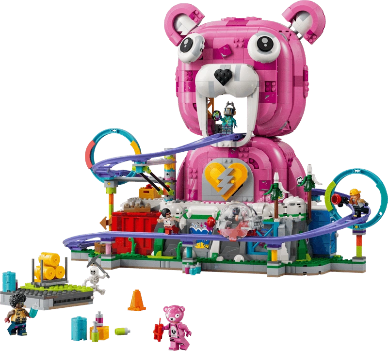 LEGO Fortnite Rave Cave 77082 showing the large pink Cuddle Team Leader bear head, purple roller coaster with loops, minifigures, snow-covered mountain and accessories.