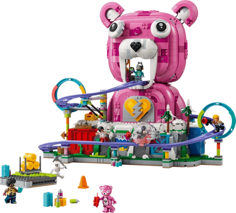 LEGO Fortnite Rave Cave 77082 showing the large pink Cuddle Team Leader bear head, purple roller coaster with loops, minifigures, snow-covered mountain and accessories.