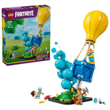 LEGO Fortnite Supply Drop box beside built supply drop model, yellow balloon, blue smoke column, minifigures and accessories