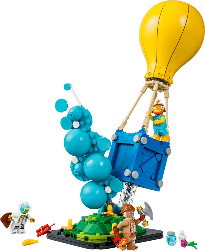 LEGO Fortnite supply drop model with yellow balloon, blue crate, smoke column, minifigures and accessories