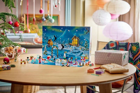 Opened LEGO Friends Advent Calendar displayed on a Christmas table with minidolls, animals and winter builds