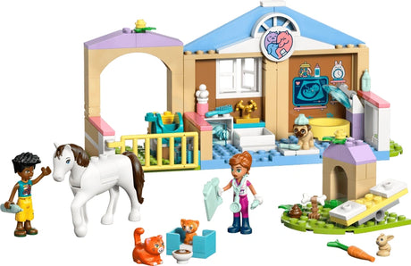 Assembled LEGO Friends Animal Vet Clinic showing the vet building, stable area, minidolls, horse and small animal figures with accessories on a white background