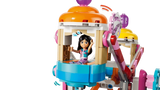 LEGO Friends minidoll seated inside a colourful Ferris wheel carriage