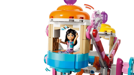 LEGO Friends minidoll seated inside a colourful Ferris wheel carriage