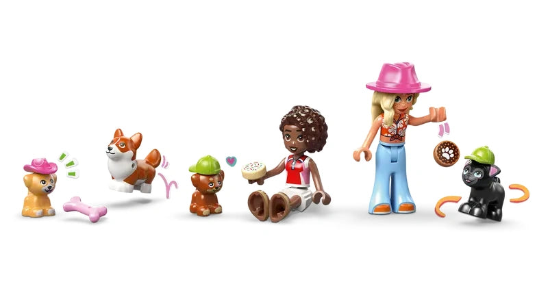 LEGO Friends Dog Treats Bakery 42677 Aliya and Sage minidolls displayed with four dog figures and bakery accessories