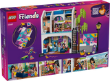 Back of LEGO Friends Liann's Family House 42687 packaging showing the furnished interior, upstairs bedroom, downstairs living area, four minidolls and illustrated play features.