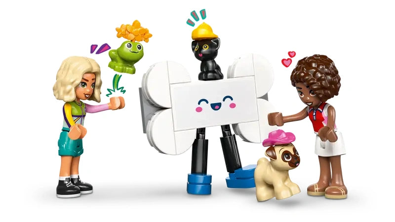 LEGO Friends Pet Accessories Van 42678 Nova and Aliya minidolls shown with dog, kitten and frog figures and bone shaped mascot figure displayed between them