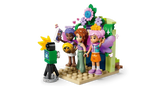 LEGO Friends photo booth scene with three minidolls, camera, flowers and fairy wings