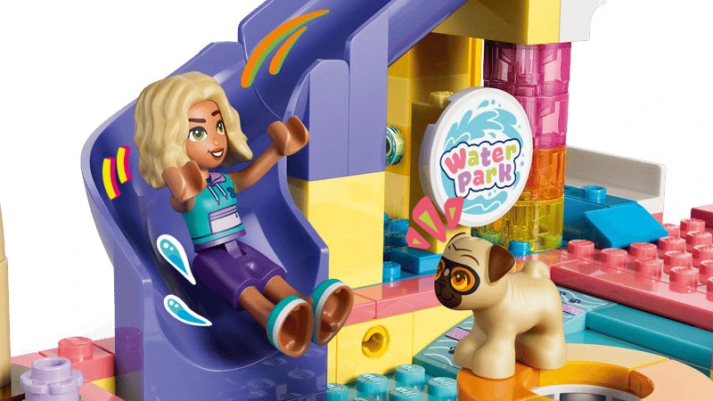 LEGO Friends mini-doll beside a purple slide with a dog figure at the water park