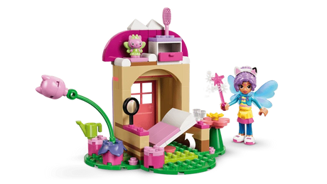 Open LEGO Gabby's Dollhouse Kitty Fairy's Garden House 11212 showing the interior, bed, Gabby and Kitty Fairy