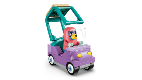 LEGO Bluey figure seated in purple car with raised roof