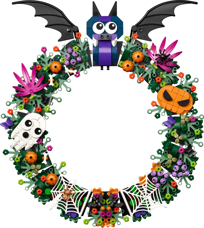 Completed LEGO Halloween Wreath 40825 decorated with a purple bat, ghost, pumpkin, flowers and spider webs