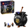 LEGO Harry Potter 76464 retail box shown beside a black brick built cauldron with brown stirring stick and two minifigures next to a small table with blue flame element
