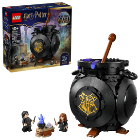 LEGO Harry Potter 76464 retail box shown beside a black brick built cauldron with brown stirring stick and two minifigures next to a small table with blue flame element