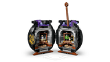 Black LEGO cauldron opened into two hinged halves revealing interior classroom with shelves, potion bottles, green and purple elements and curved arrow graphic below