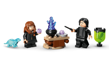 Hermione Granger holding light purple potion bottle and Professor Snape holding black wand beside small round build with blue translucent flame element, light blue otter figure and green translucent container on stand