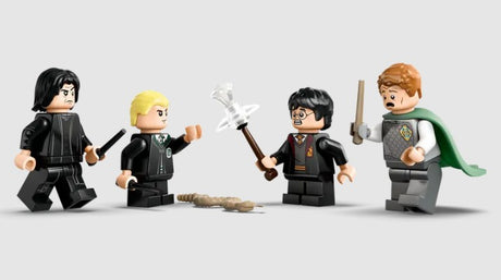 Close-up of the LEGO Harry Potter, Draco, Snape, and Lockhart minifigures.