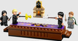 Harry Potter and Draco Malfoy duel on the Dueling Club platform with Snape watching.